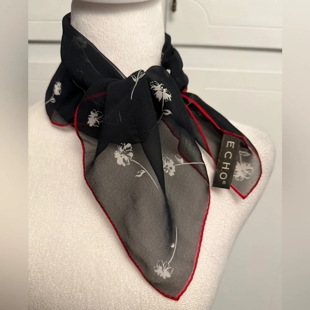 ECHO Small Black Sheer and stretch Scarf with white floral and red outline.
